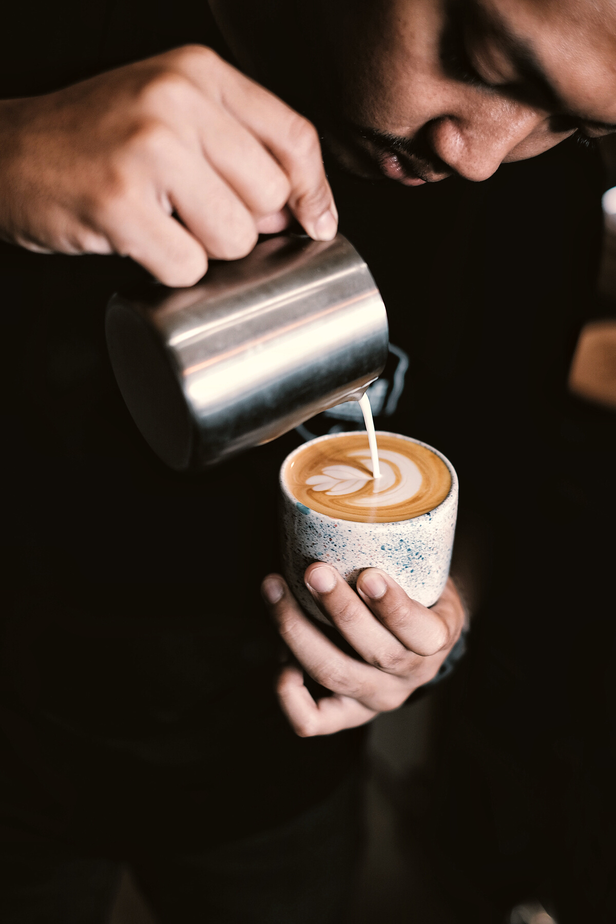 Man Pouring Coffee on Ceramic Mug